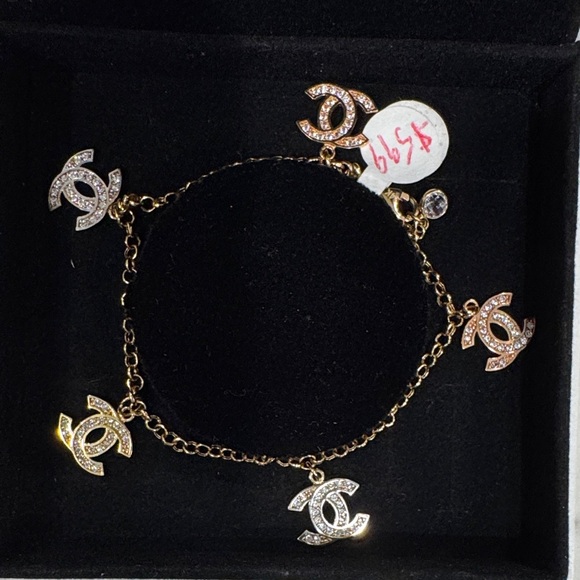 CHANEL Gold and Silver Logo Charm Bracelet - Picture 1 of 4